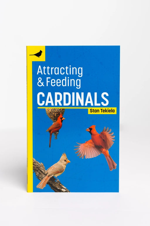 Book cover of 'Attracting & Feeding Cardinals' by Stan Tekiela with images of cardinals on a blue background.