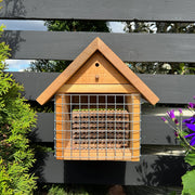 Chalet Bee House and Bee Cocoon Hatchery™ Combo
Bee Guard and Nesting Blocks not included
Bee house in use on black fence