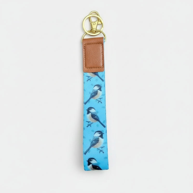 Keychain with bird pattern on a white
background
