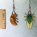 Cicada Earrings with ruler for scale
