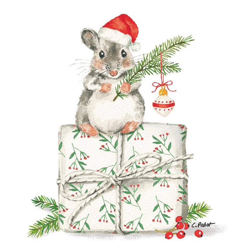 little grey mouse in Santa hat sitting on a box holding an evergreen sprig with an ornament hanging from it. white background. 