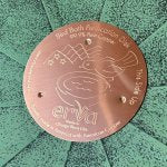 Copper bird bath disk in bath