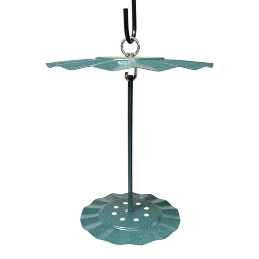 Green metal cylinder feeder with a white background