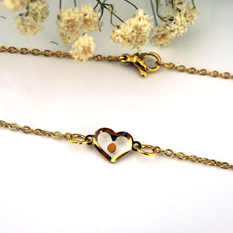 Mustard Seed heart necklace with delicate white flowers