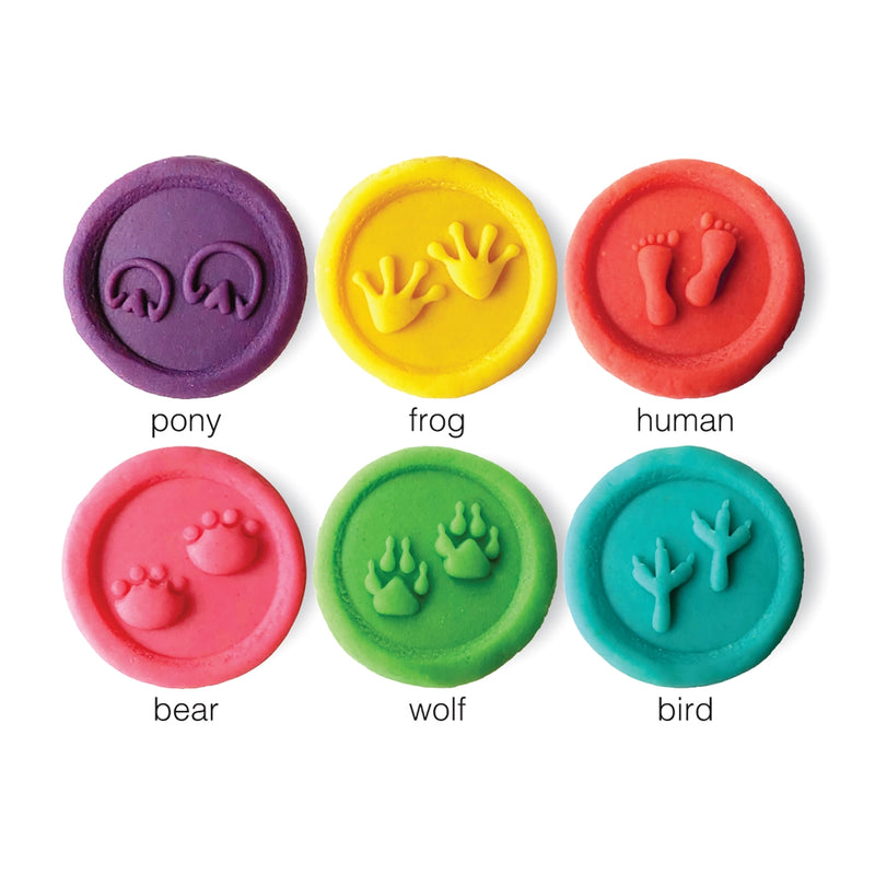 up close of footprint stamp examples in different colored dough