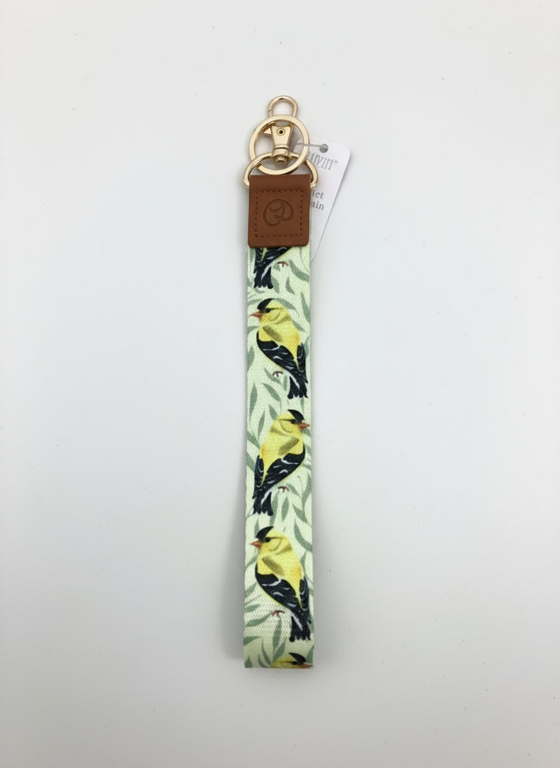 Keychain with bird pattern on a light surface