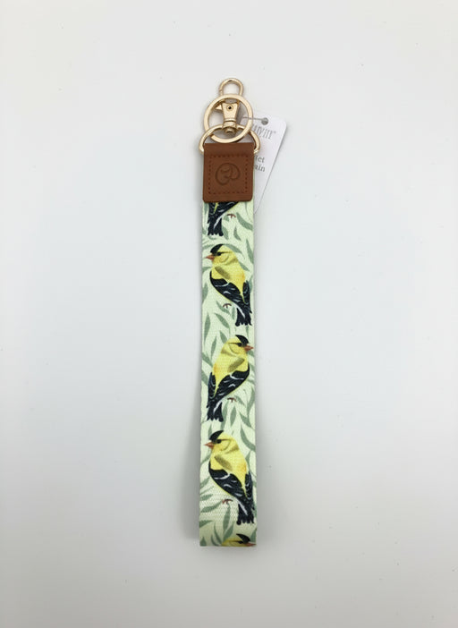 Keychain with bird pattern on a light surface