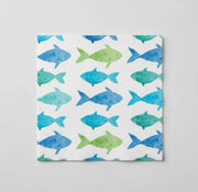 Aquarell fish napkin with various shades of blue and green fish outlines