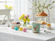 mug of hot coffee on an springtime breakfast table