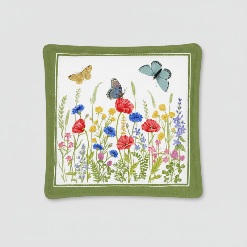 Decorative square pillow with floral and butterfly design on a white background