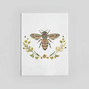 Guest size napkin with decorative illustration of a bee with floral elements on a white background
