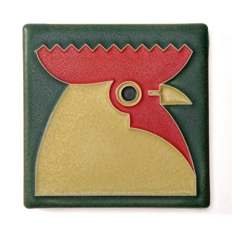 Decorative tile with a rooster design on a green background