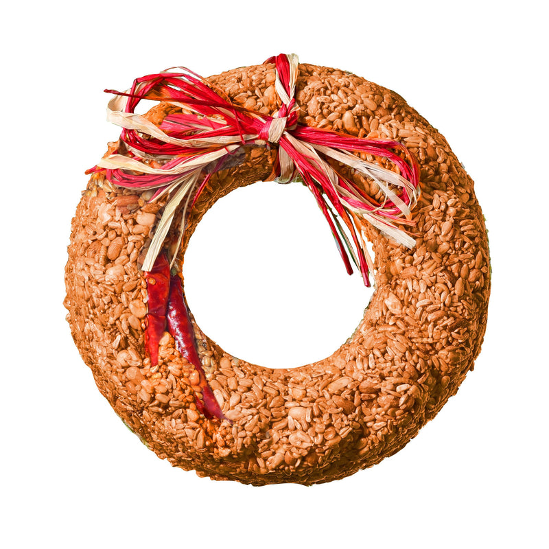 Wreath-shaped birdseed cake with a red and beige ribbon on a white background