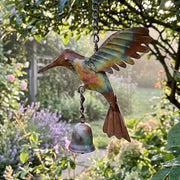 Flamed Hummingbird Ornament in a garden setting