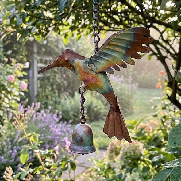 Flamed Hummingbird Ornament in a garden setting
