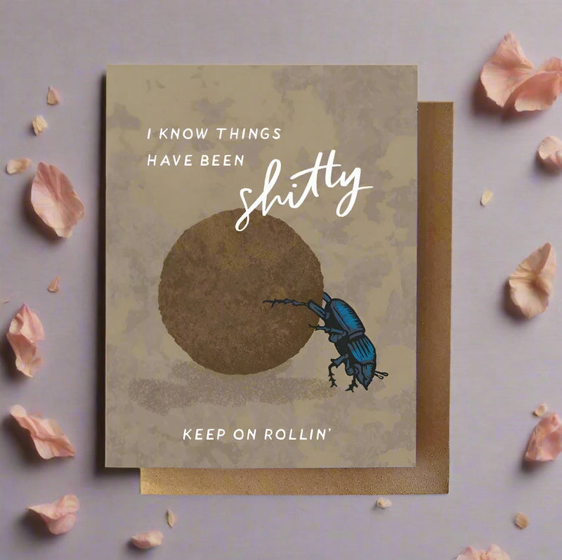 Card with beetle illustration and motivational text on a textured background