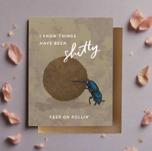 Card with beetle illustration and motivational text on a textured background