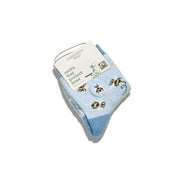 Pair of preschool size blue socks with bee design and tag on a white background