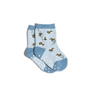 Pair of light blue preschool size socks with bee pattern and sticky dot feet on a white background