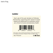 Back of a clothing tag for a toddler item, detailing donation to Pollinator Partnership.