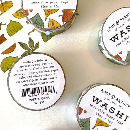 Washi tape with leaf designs and branding on a white background