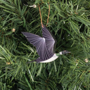 Decorative loon ornament on a Christmas tree
