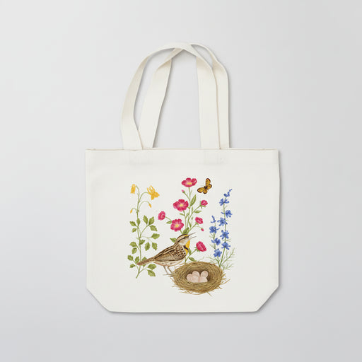 Tote bag with a bird and nest design on a white background