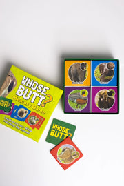 Children's game 'Whose Butt?' with cards and packaging on a white background