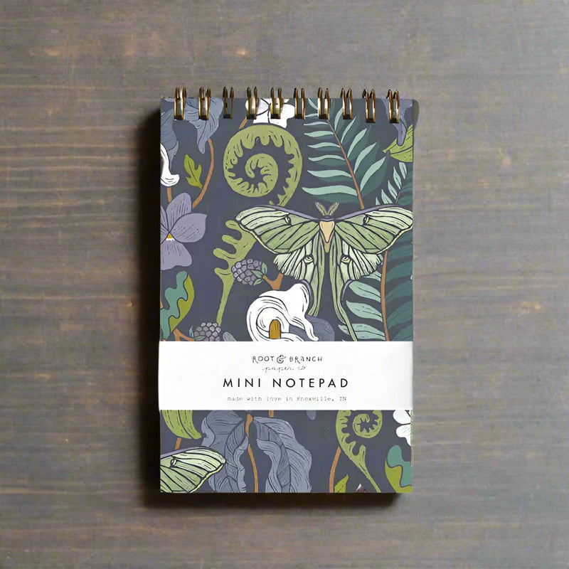 Mini notepad with nature-themed design on a natural background