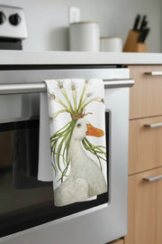 Miranda the Goose kitchen towel hanging on an over door