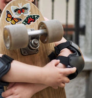 Monarch Butterfly Vinyl Sticker - with Caterpillar in use on a skateboard