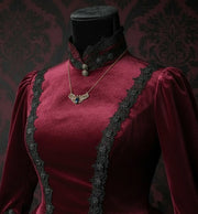 Necklace with a witch moth pendant on a mannequin bust against a dark background for size and scale