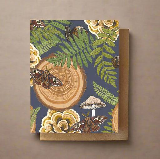 Greeting card with nature-themed design featuring mushrooms moths and snails on a slate gray background.