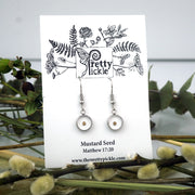 Small Circle Mustard Seed Earrings
with packaging