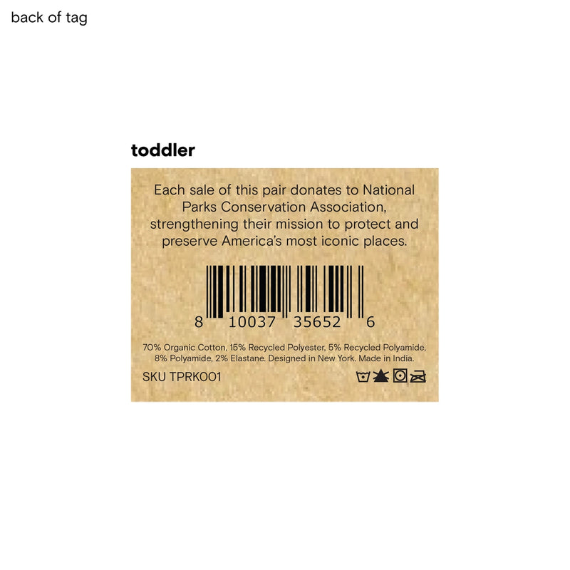 Back of a toddler sock tag with text and barcode on a white background