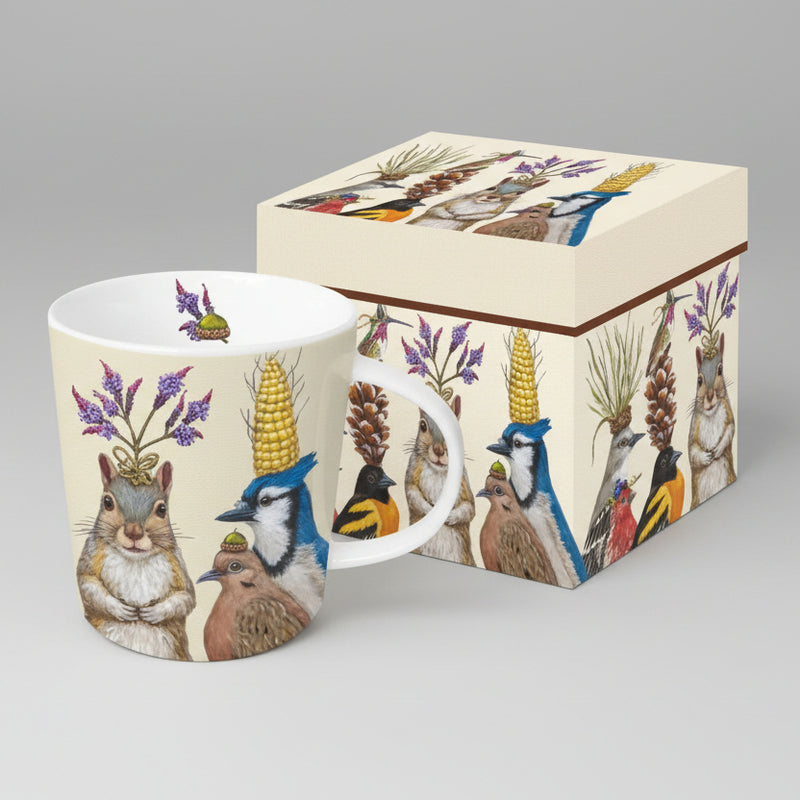 Mug with nature-themed design featuring animals with plant hats, next to a matching box.