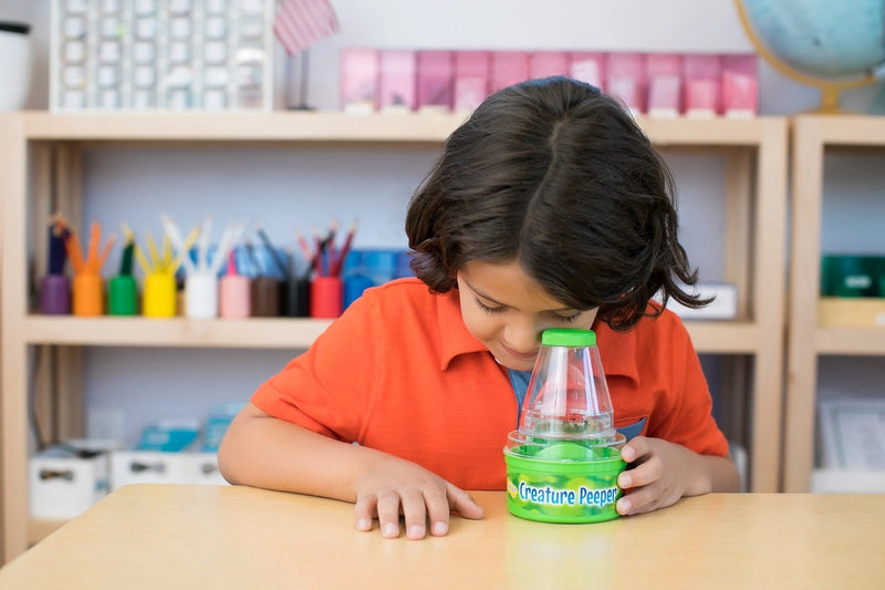 Creature Peeper bug collecting magnifier in use