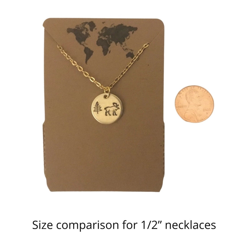 Hummingbird Circular Charm Necklace in Silver Color with penny for size comparison