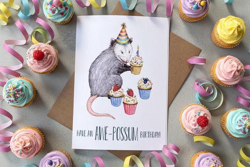 birthday cards surrounded by cupcakes