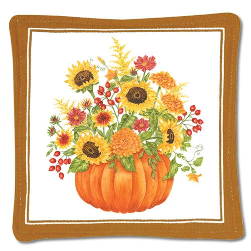 Decorative mug mat with a pumpkin and floral design on a white background