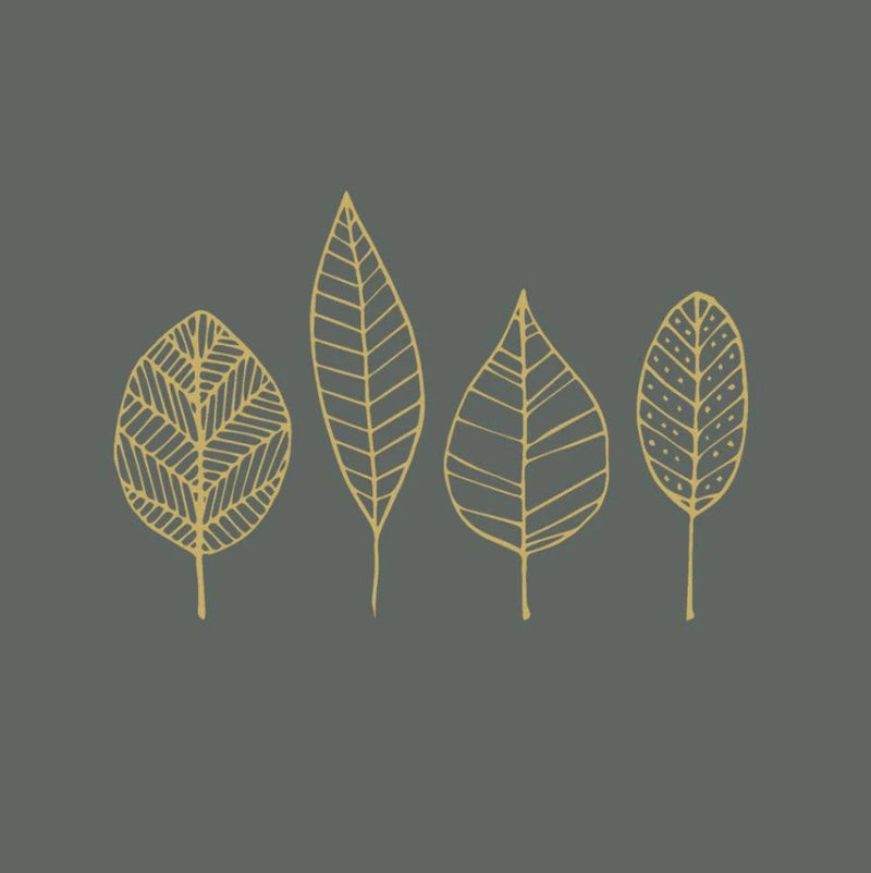 Four gold leaf illustrations on a dark gray napkin