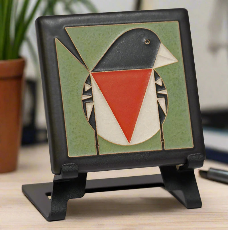 Decorative tile with a red breasted grosbeak design on an easel (easel not included).