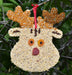 Rudolph Christmas Cookie Seed Ornament with greenery background