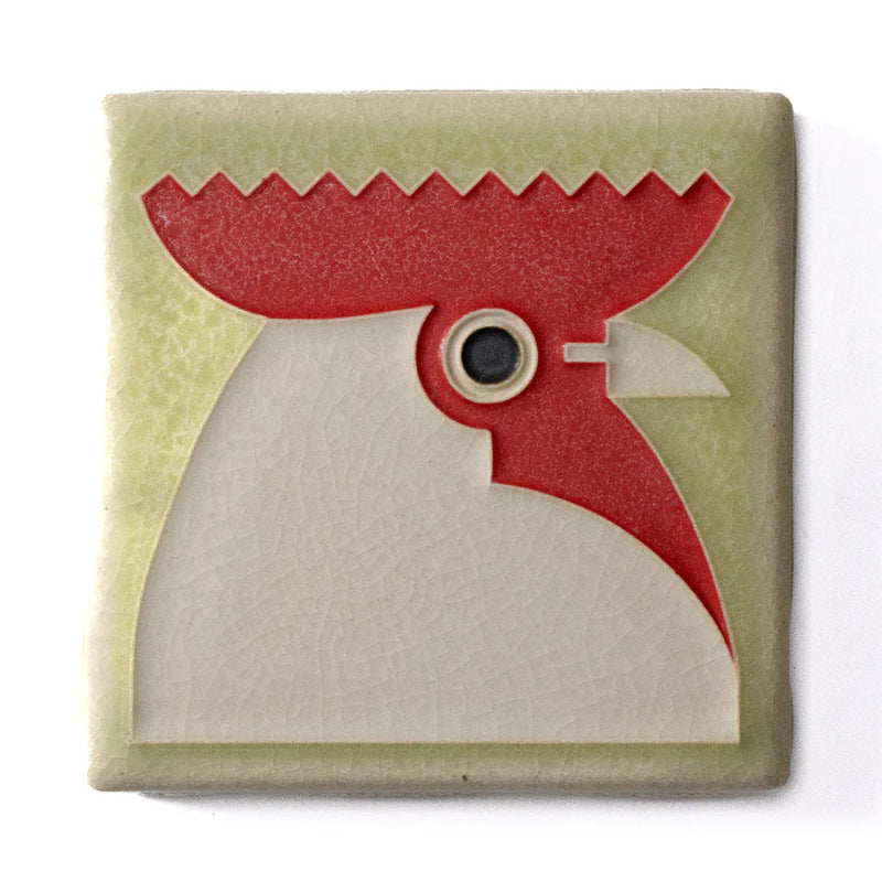 Decorative tile with a red and beige rooster design on a light sage green background