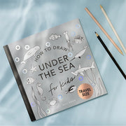 Howl to Draw Under the Sea book with pencils to the side