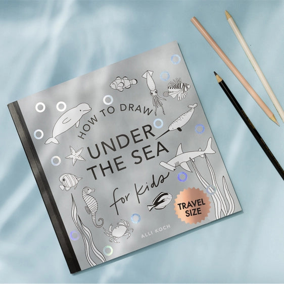 Howl to Draw Under the Sea book with pencils to the side