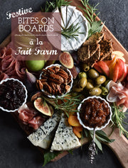 Platter of assorted meats, cheeses, fruits, and nuts with 'Festive Bites on Boards a la Tait Farm' text overlay.