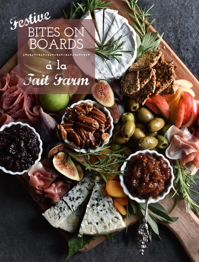 Platter of assorted meats, cheeses, fruits, and nuts with 'Festive Bites on Boards a la Tait Farm' text overlay.