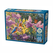 Jigsaw puzzle box with bluebirds and flowers on a white background