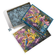 Jigsaw puzzle with a floral and bird design, partially completed, on a white background.
